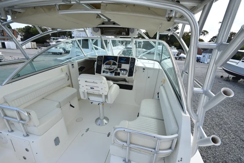 Slide: The Image of 2008 World Cat 32 EC boat interior with helm, seating, and controls. - 12