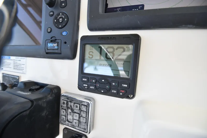 Slide: The Image of 2008 World Cat 32 EC boat dashboard with navigation controls and display. - 16