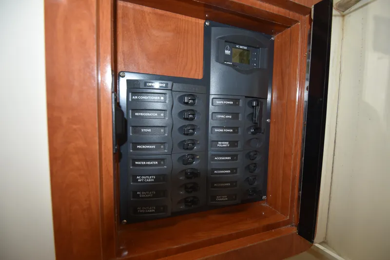 Slide: The Image of Electrical panel of 2008 World Cat 32 EC boat with labeled switches. - 23