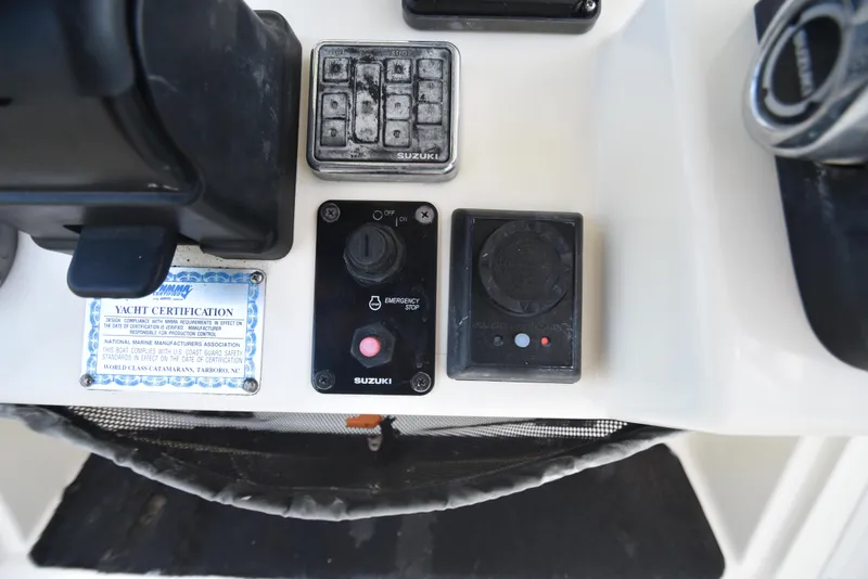 Slide: The Image of Control panel of a 2008 World Cat 32 EC boat with Suzuki components. - 9