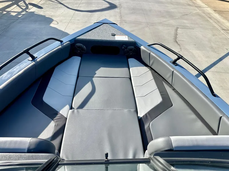 Slide: The Image of 2025 Lowe FS1700 boat interior with gray seating and sleek design. - 3