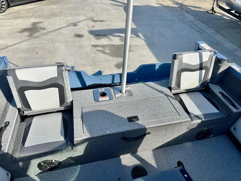 Slide: The Image of 2025 Lowe FS1700 boat interior with seating and storage compartments. - 6