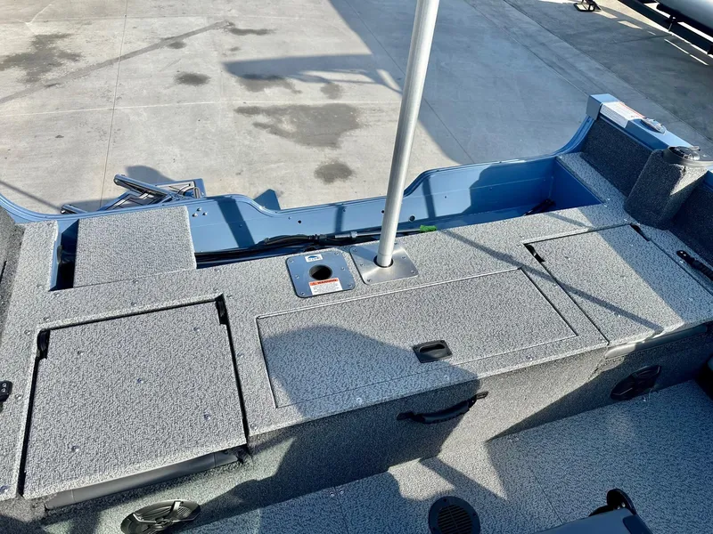 Slide: The Image of 2025 Lowe FS1700 boat interior with 115HP Mercury engine, featuring spacious deck layout. - 7