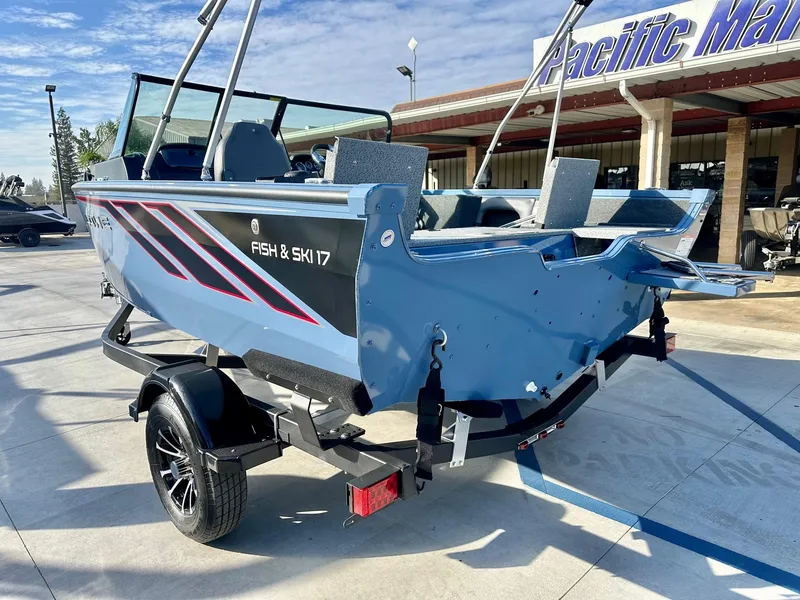 Slide: The Image of 2025 Lowe FS1700 boat with 115HP Mercury engine, parked at Pacific Marine. - 9