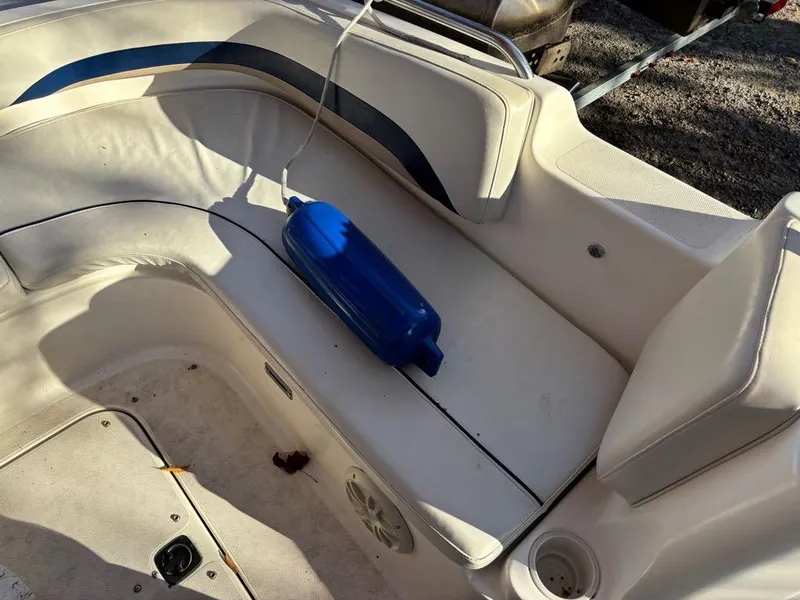 Slide: The Image of 2007 Hurricane Fun Deck GS 231 boat interior with seating and blue fender. - 10