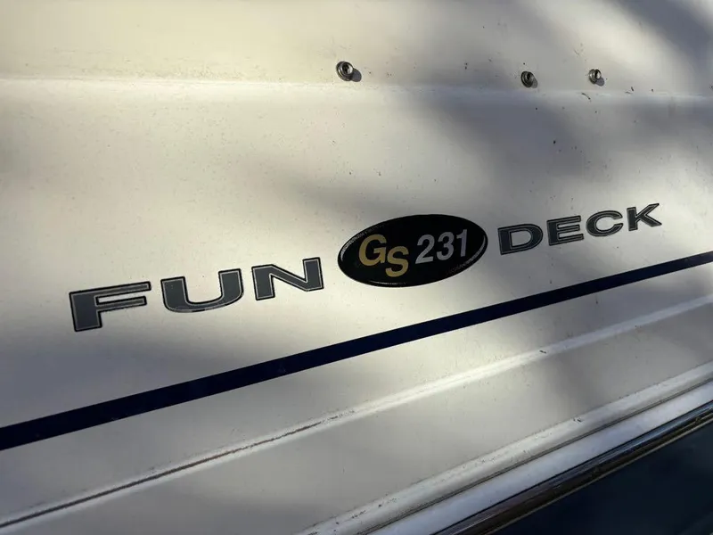 Slide: The Image of 2007 Hurricane Fun Deck GS 231 boat logo on white surface. - 17