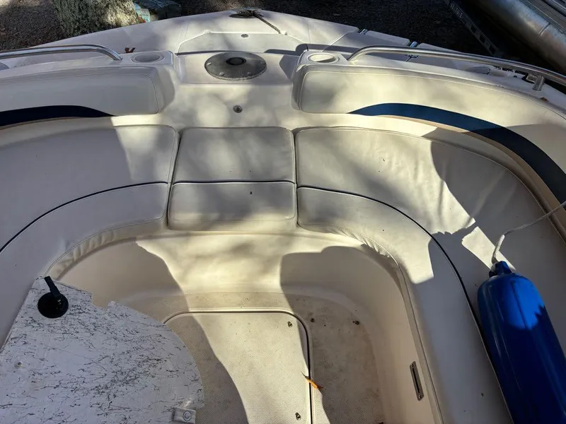 Slide: The Image of 2007 Hurricane Fun Deck GS 231 boat interior with cushioned seating and blue fender. - 3