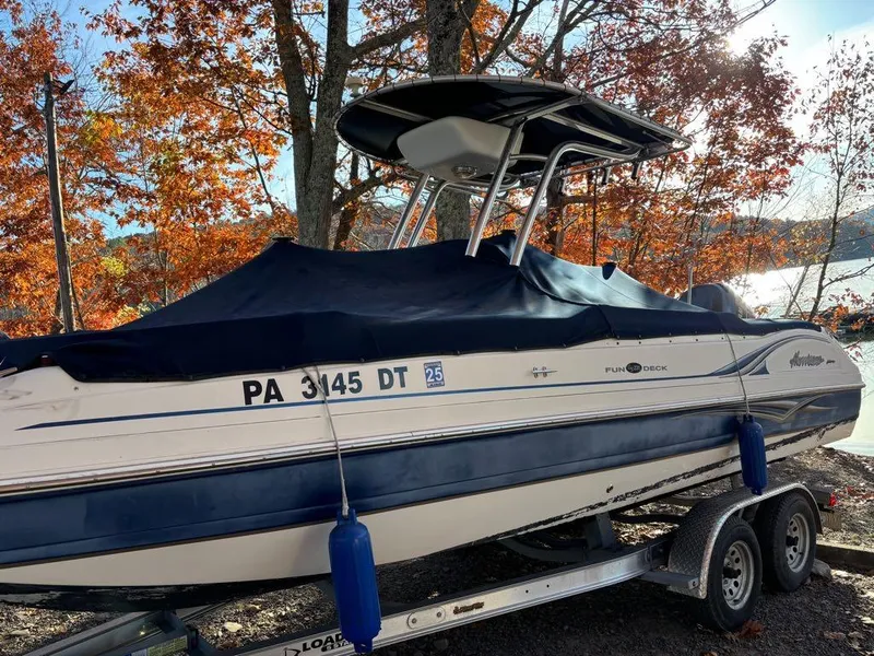 Slide: The Image of 2007 Hurricane Fun Deck GS 231 boat on trailer, autumn trees in background. - 4