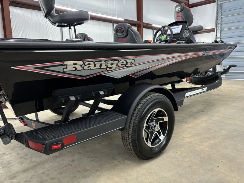 Slide: The Image of 2024 Ranger RT178 boat on trailer in garage setting. - 11