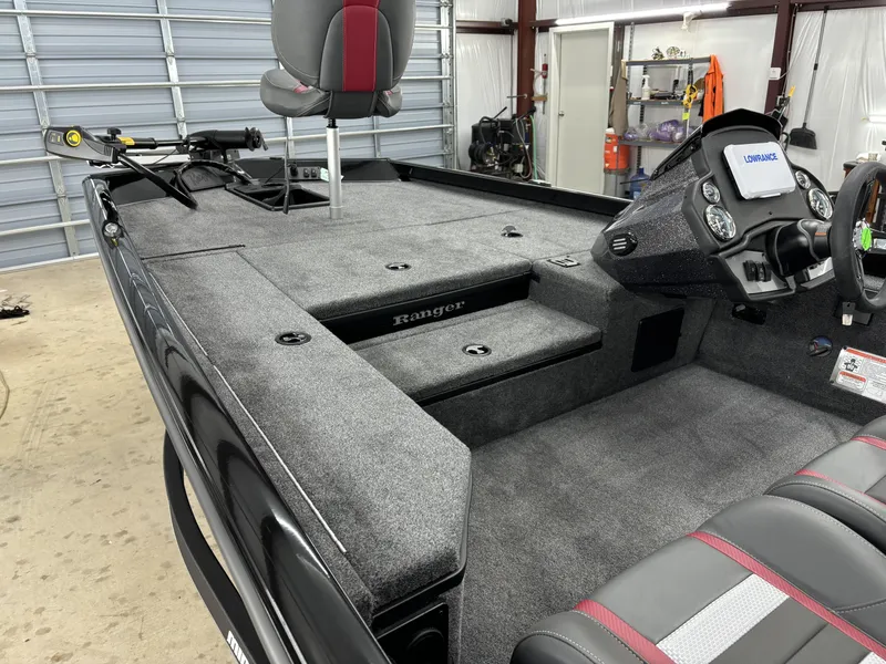 Slide: The Image of 2024 Ranger RT178 boat interior with seating and control panel in a garage setting. - 14