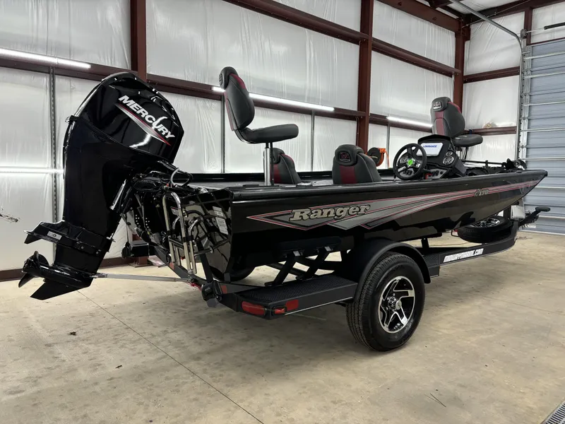 Slide: The Image of 2024 Ranger RT178 boat with Mercury engine in a garage setting. - 4