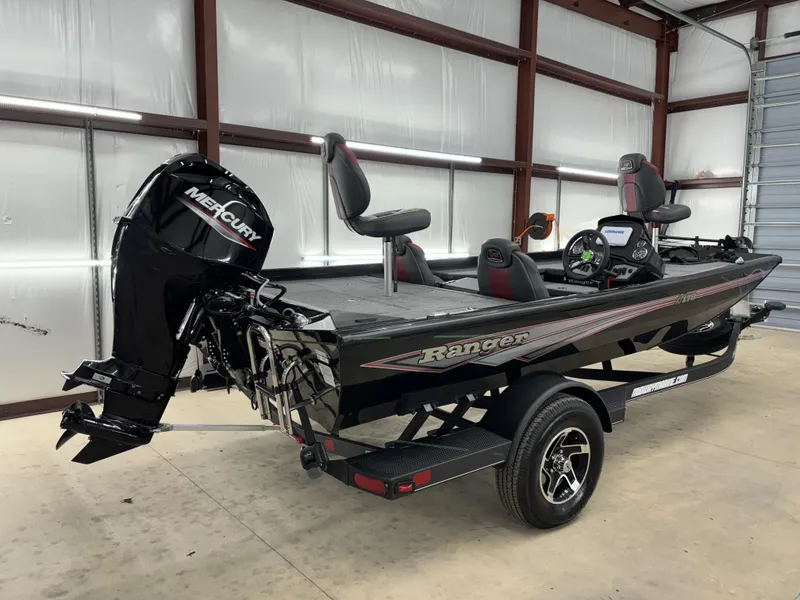 Slide: The Image of 2024 Ranger RT178 fishing boat with Mercury engine in a garage setting. - 5