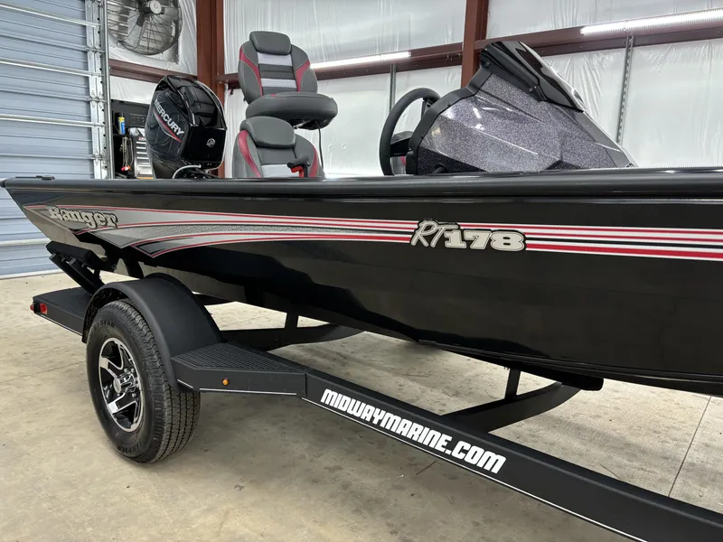 Slide: The Image of 2024 Ranger RT178 boat on trailer in garage setting. - 6