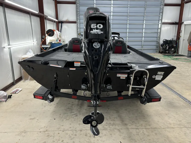 Slide: The Image of 2024 Ranger RT178 boat with Mercury 60 engine in a garage setting. - 7