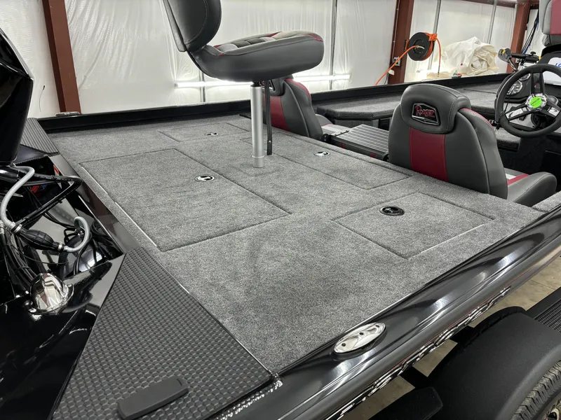 Slide: The Image of 2024 Ranger RT178 boat interior with gray carpet and seating. - 8