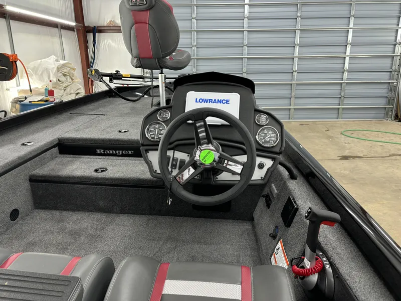 Slide: The Image of 2024 Ranger RT178 boat interior with steering wheel and Lowrance electronics. - 9