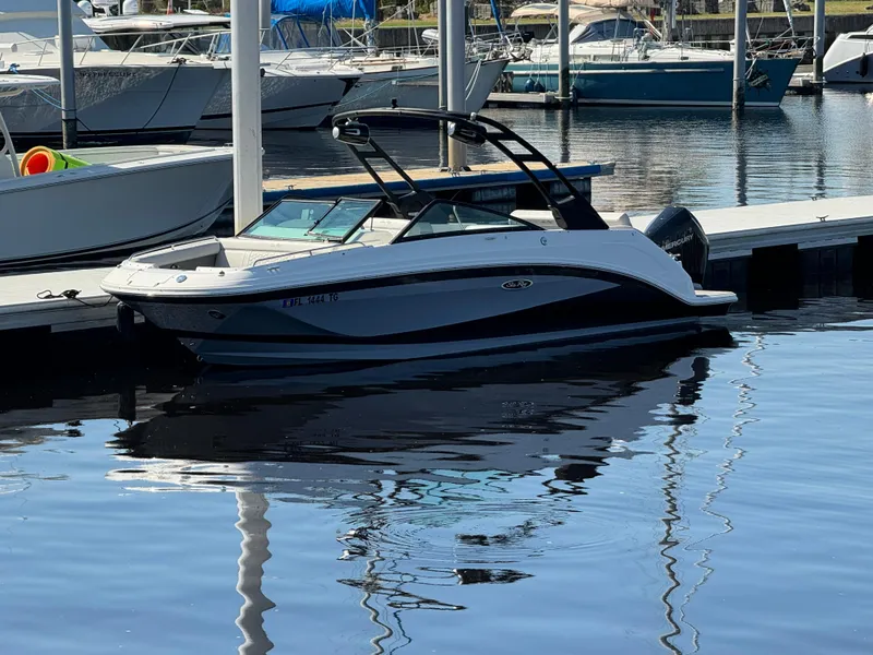 Slide: The Image of 2022 Sea Ray SDX 250 Outboard boat docked at marina. - 3
