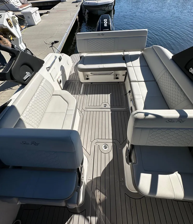 Slide: The Image of 2022 Sea Ray SDX 250 Outboard boat interior with spacious seating and modern design. - 5