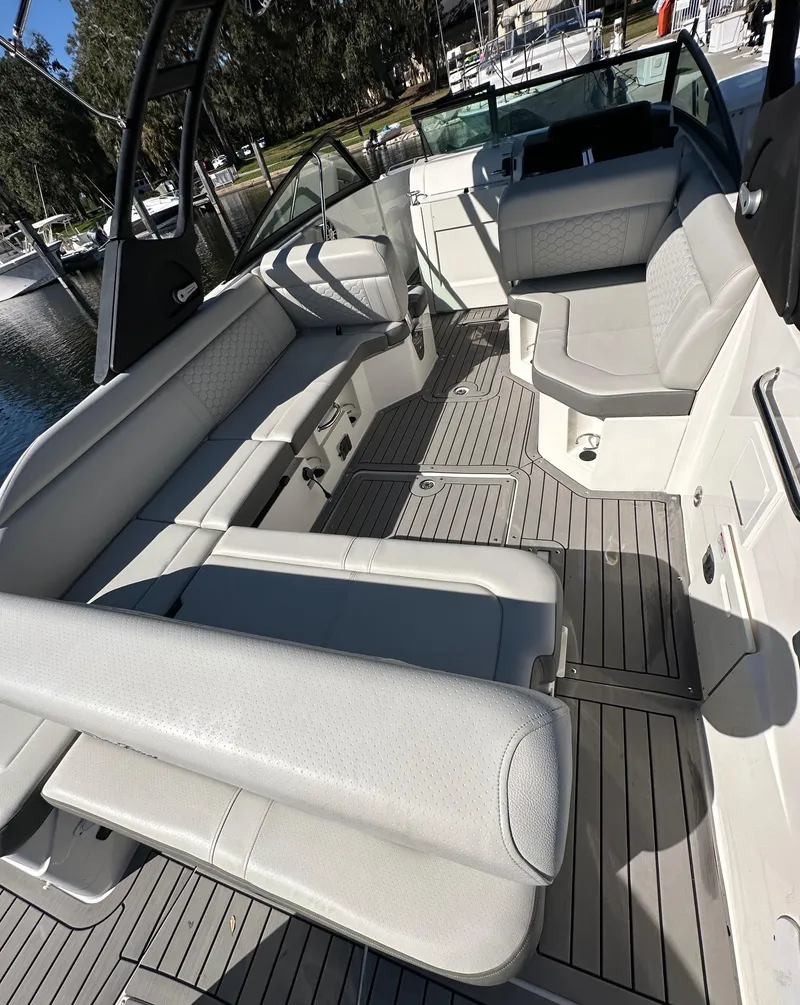 Slide: The Image of 2022 Sea Ray SDX 250 Outboard interior with spacious seating and modern design. - 7