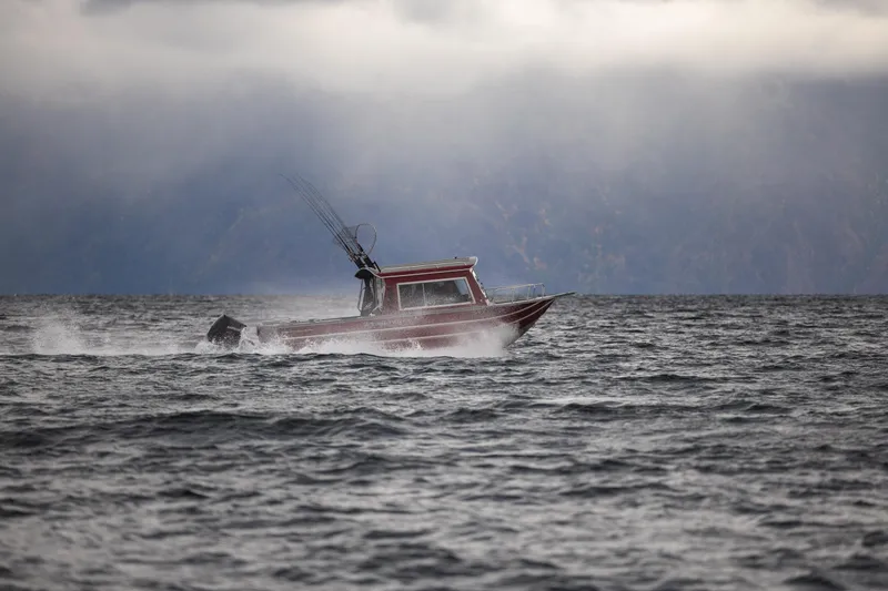 Slide: The Image of 2024 Spartan 26 Maximus Pro XL boat interior with storage compartments and sleek design. - 12