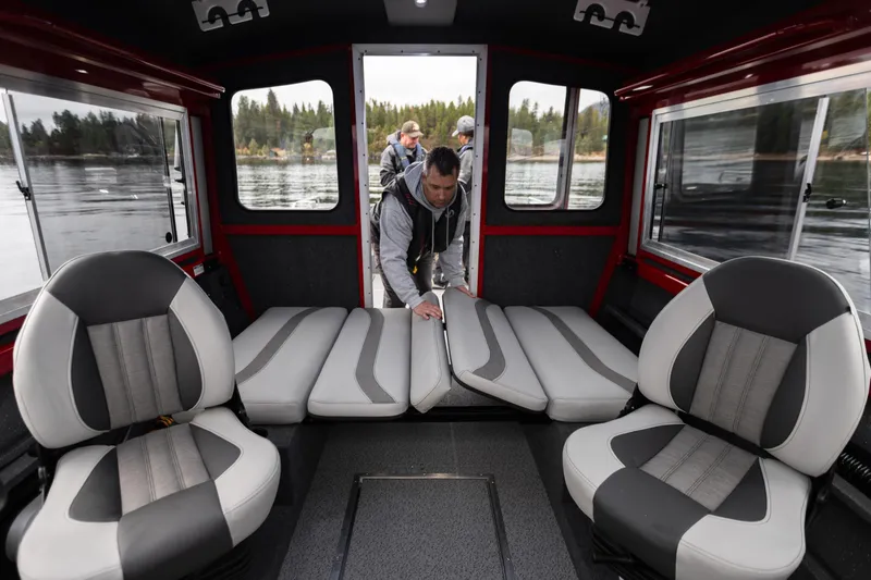 Slide: The Image of 2024 Spartan 26 Maximus Pro XL boat interior with steering wheel and captain's chair. - 21