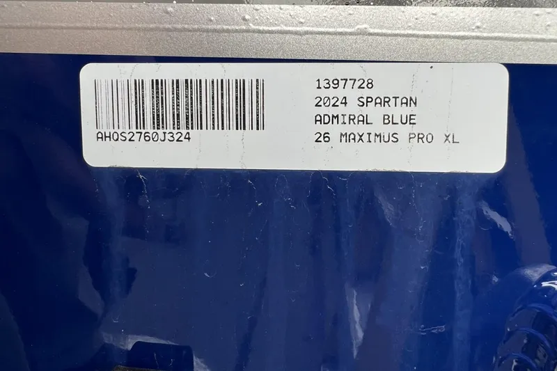 Slide: The Image of Label on blue surface showing 2024 Spartan 26 Maximus Pro XL details. - 27