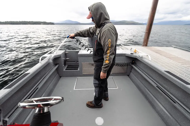 Slide: The Image of 2024 Spartan 26 Maximus Pro XL boat with dual 250 V8 engines in snowy setting. - 11