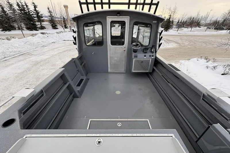 Slide: The Image of 2024 Spartan 26 Maximus Pro XL boat interior, showcasing spacious deck and control cabin. - 14