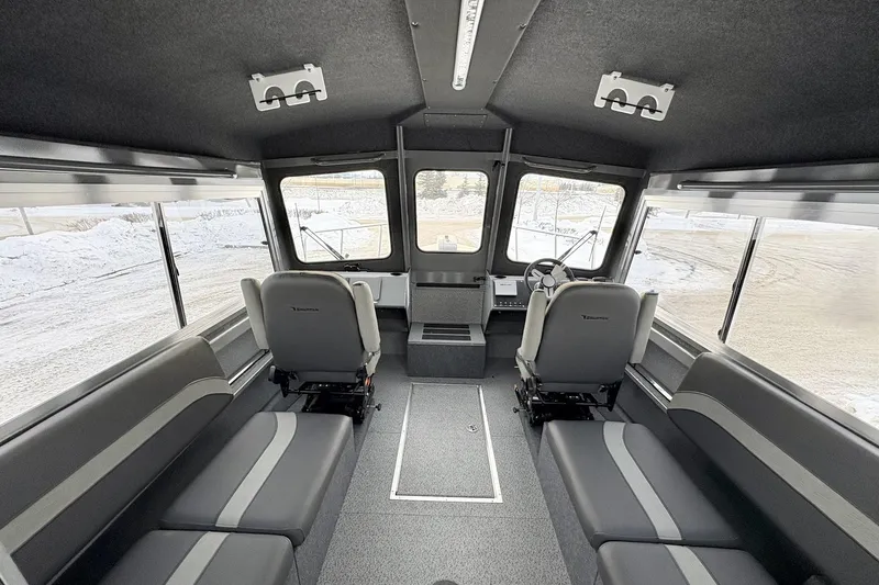 Slide: The Image of Interior of 2024 Spartan 26 Maximus Pro XL boat, featuring spacious seating and modern design. - 19
