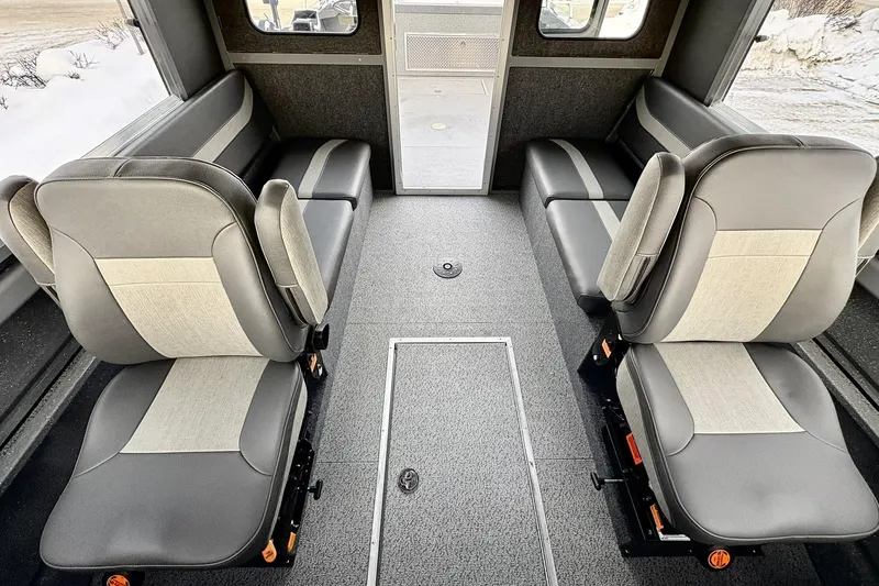 Slide: The Image of 2024 Spartan 26 Maximus Pro XL interior with gray seating and spacious layout. - 25