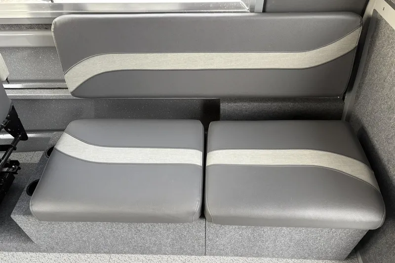 Slide: The Image of 2024 Spartan 26 Maximus Pro XL interior seating with gray upholstery and modern design. - 27