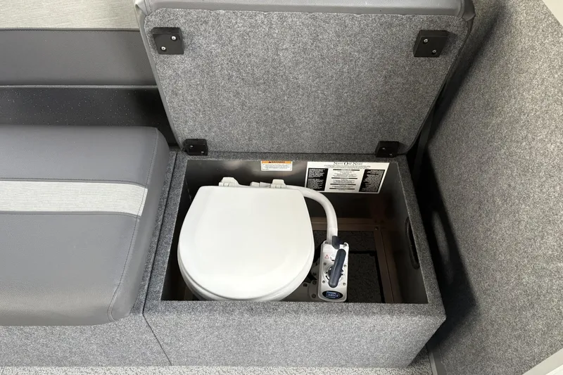 Slide: The Image of 2024 Spartan 26 Maximus Pro XL interior with hidden toilet compartment. - 28