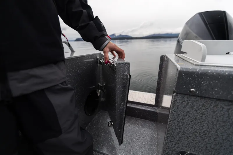 Slide: The Image of 2024 Spartan 26 Maximus Pro XL boat on trailer in snowy parking lot. - 5