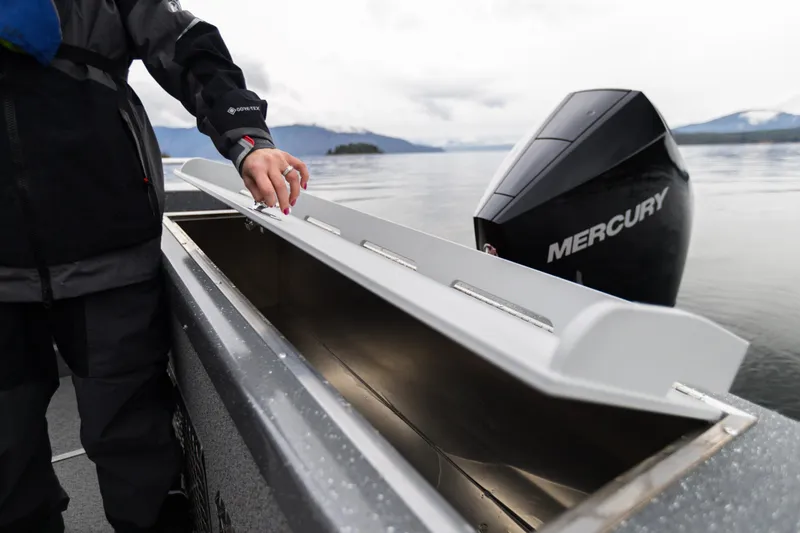 Slide: The Image of 2024 Spartan 26 Maximus Pro XL boat on trailer in snowy parking lot. - 6