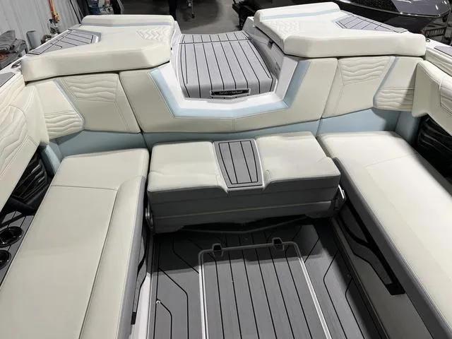 Slide: The Image of 2025 Nautique Super Air Nautique G25 interior with luxurious seating and modern design. - 11