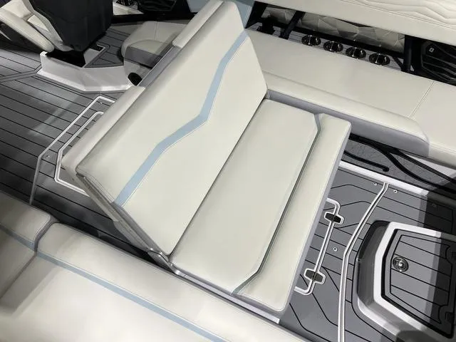 Slide: The Image of 2025 Nautique Super Air Nautique G25 interior seating with sleek, modern design. - 15