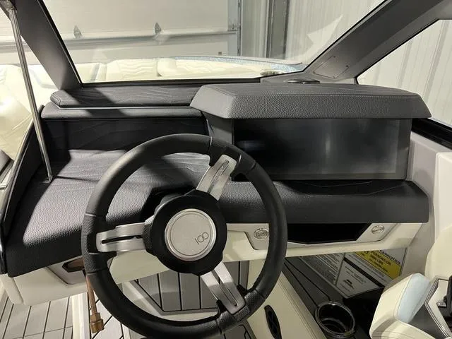 Slide: The Image of 2025 Nautique Super Air Nautique G25 dashboard with steering wheel and display. - 27