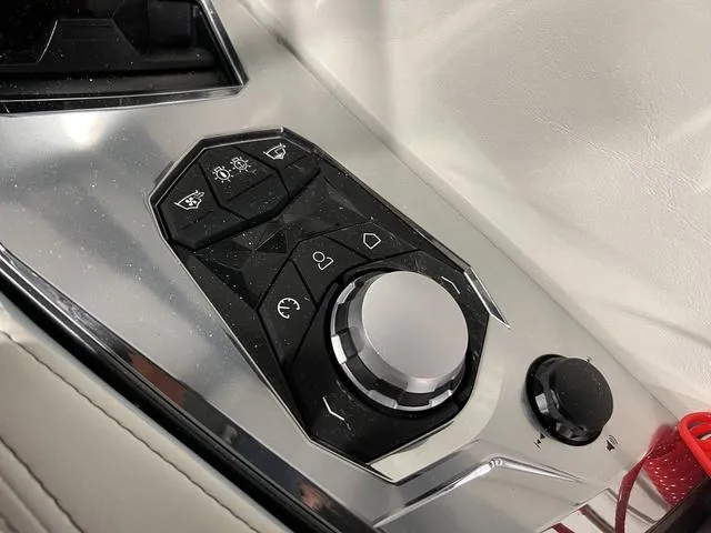 Slide: The Image of Control panel of 2025 Nautique Super Air Nautique G25 boat, featuring sleek design and buttons. - 28
