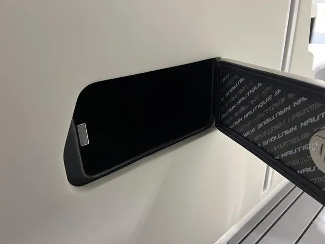 Slide: The Image of 2025 Nautique Super Air Nautique G25 storage compartment detail. - 29