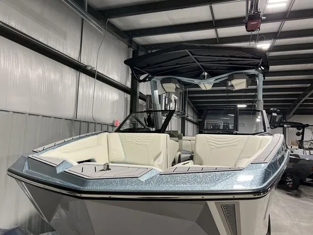 Slide: The Image of 2025 Nautique Super Air Nautique G25 boat, sleek design, light blue and white color scheme. - 3