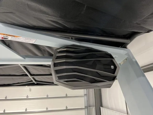Slide: The Image of 2025 Nautique Super Air Nautique G25 boat speaker detail in a garage setting. - 35