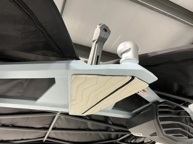 Slide: The Image of 2025 Nautique Super Air Nautique G25 boat interior detail with speaker and cup holder. - 37