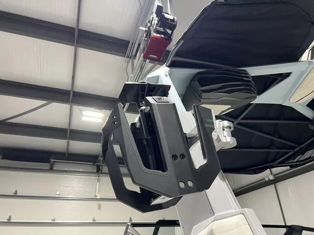 Slide: The Image of 2025 Nautique Super Air Nautique G25 wakeboard rack in a garage setting. - 39