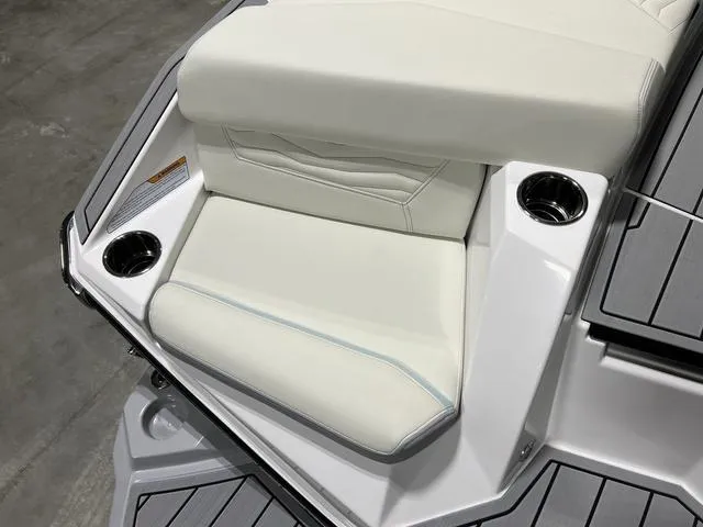 Slide: The Image of Interior of 2025 Nautique Super Air Nautique G25 boat, featuring modern seating and dashboard. - 8