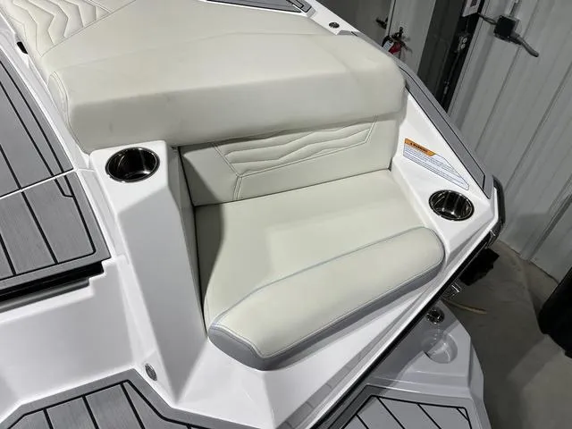 Slide: The Image of 2025 Nautique Super Air Nautique G25 boat, sleek design, light blue and white color scheme. - 9