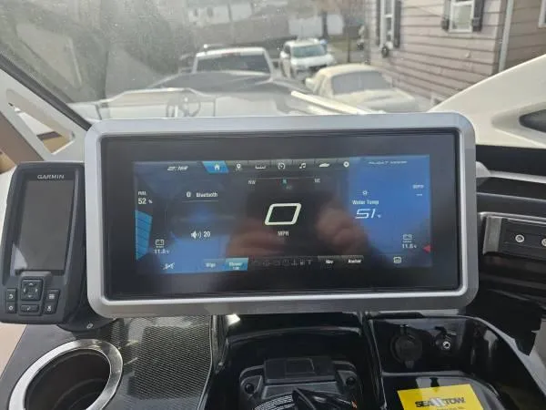 Slide: The Image of Dashboard of 2023 Yamaha Boats 275 SDX with digital display and controls. - 10