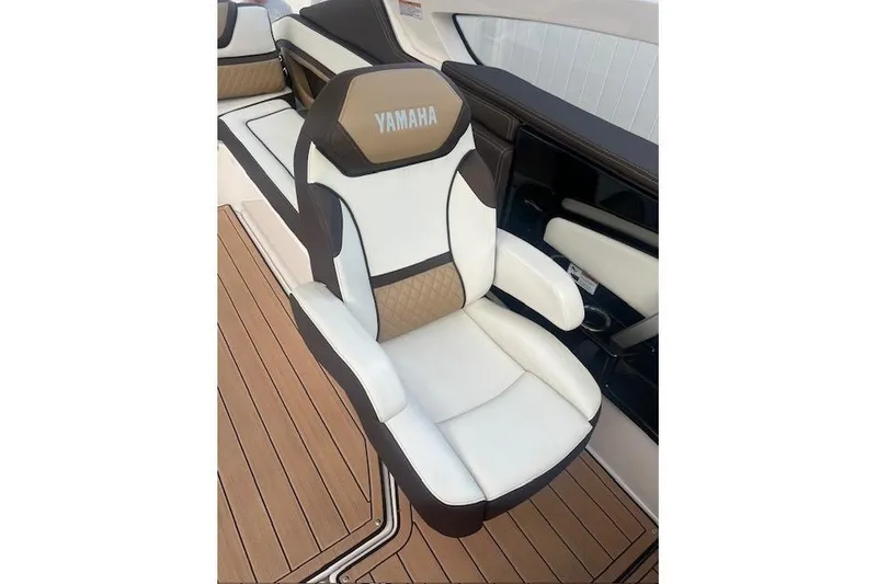 Slide: The Image of 2023 Yamaha Boats 275SDX interior with luxurious seating and elegant design. - 21
