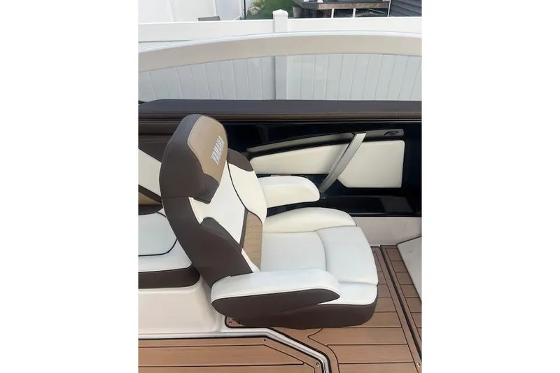 Slide: The Image of 2023 Yamaha Boats 275SDX interior with luxurious seating and modern design. - 31