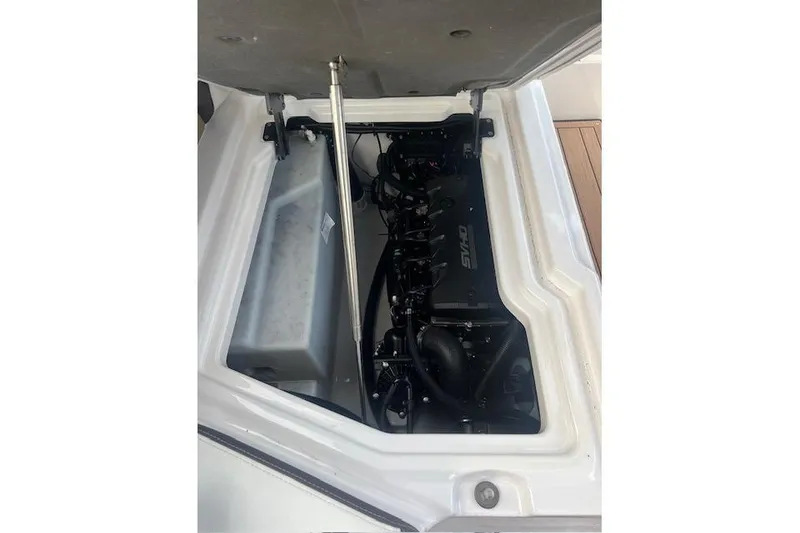 Slide: The Image of 2023 Yamaha Boats 275SDX engine compartment with open hatch, showcasing internal components. - 39