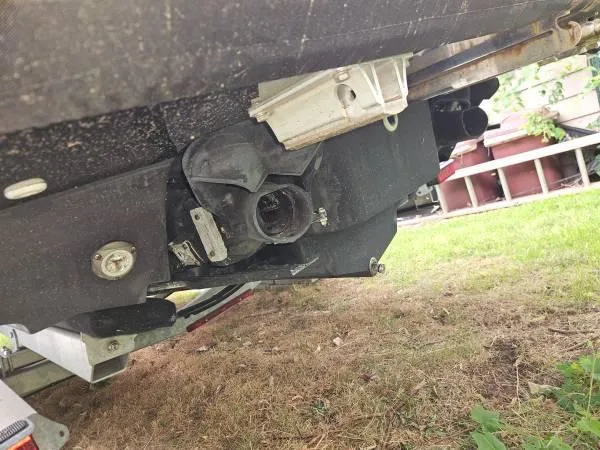 Slide: The Image of Close-up of 2023 Yamaha Boats 275 SDX jet propulsion system on grass. - 40